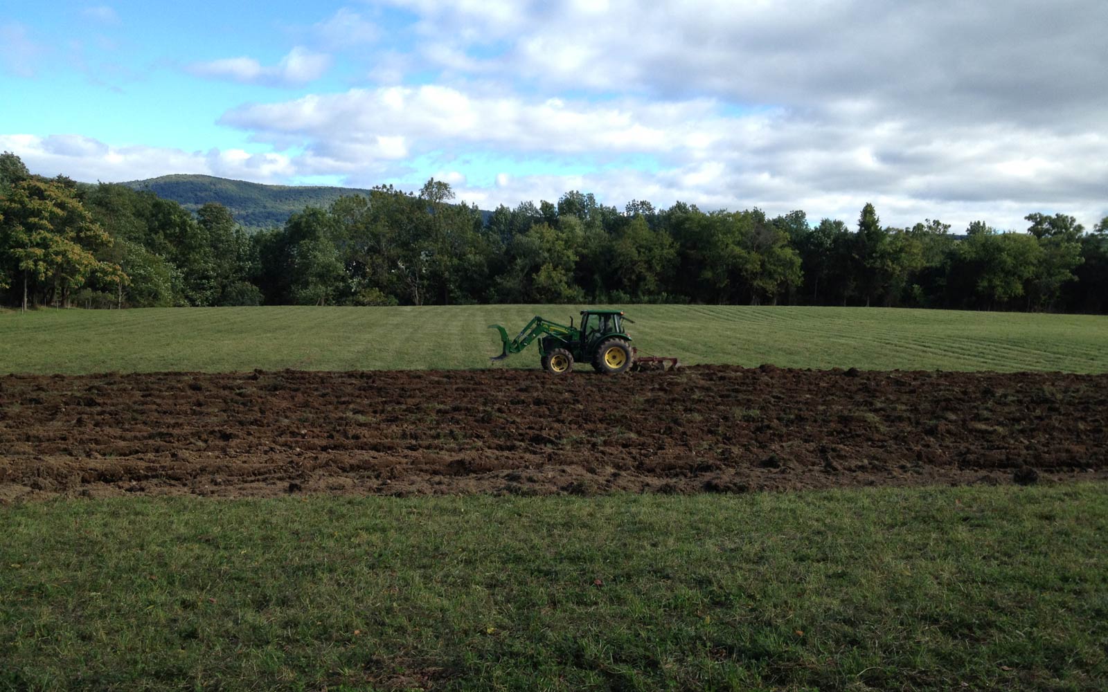 vernon valley farm - tractor in field